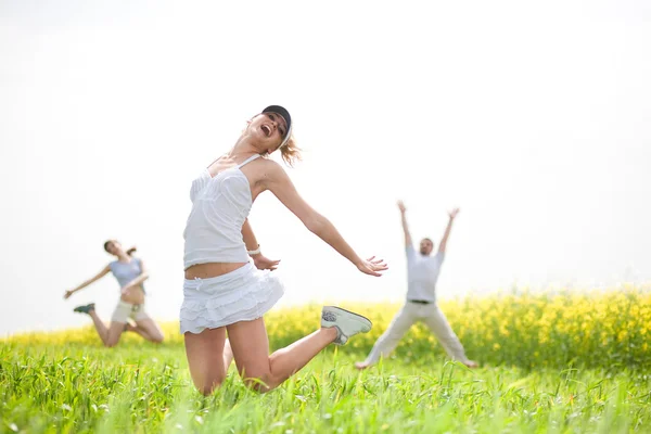 Happy is jumping in field — Stock Photo, Image