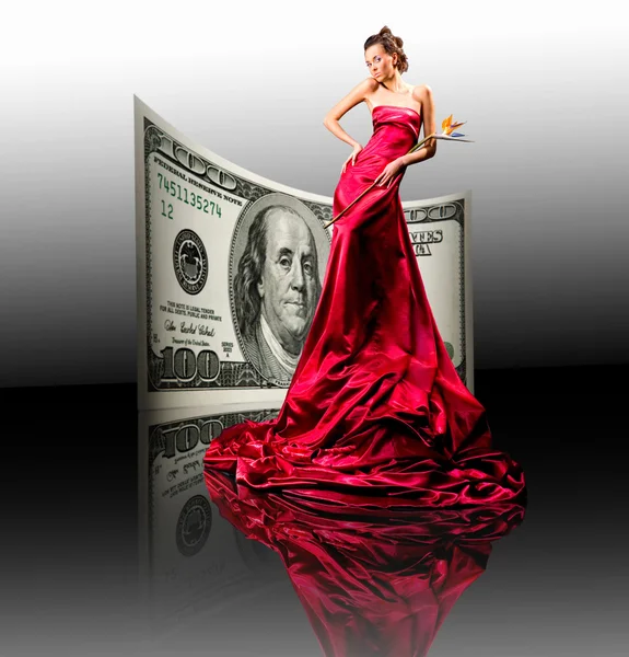 Piękna dziewczyna w czerwonej sukience, pieniądze. 100 dolarów amerykańskich — Zdjęcie stockowe