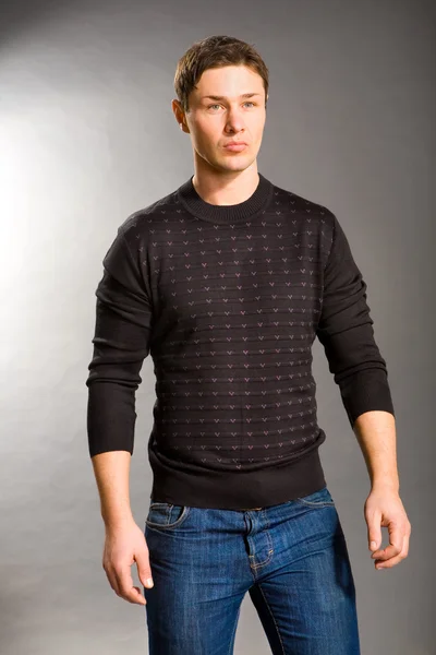 Young men dressed in sweater and jeans — Stock Photo, Image