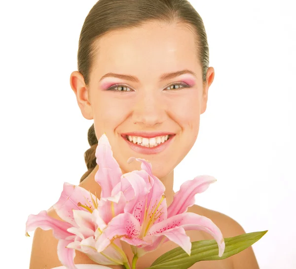 Vacker ung flicka med blomma. fokusera på ögonen — Stockfoto