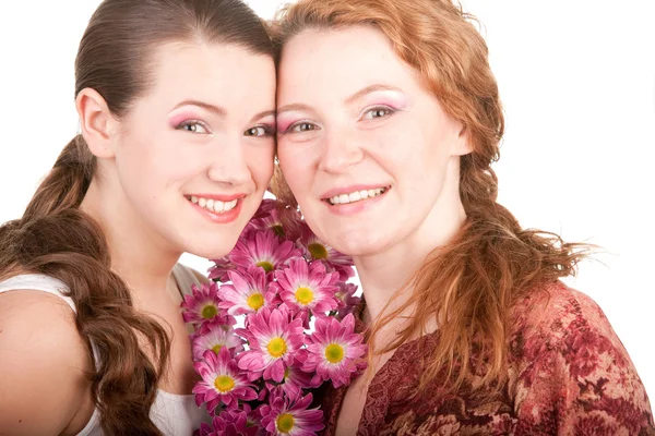 Matka a dcera s květem. zaměřit se na oči — Stock fotografie