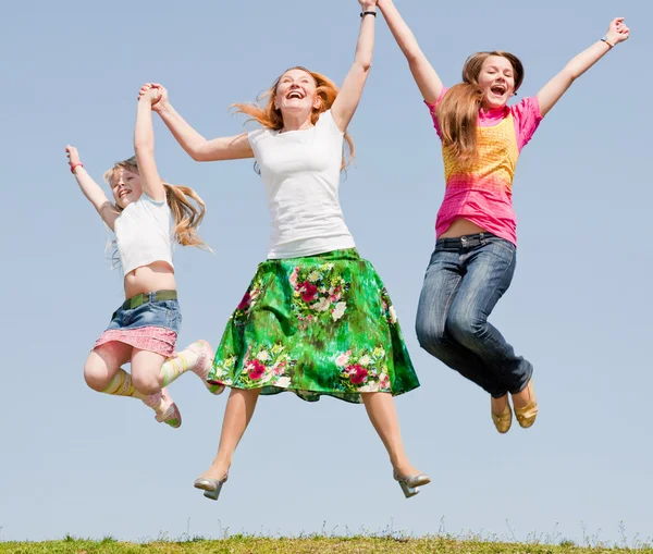 Happy Mother Two Daughter Jumping Green Meadow — Stock Photo, Image