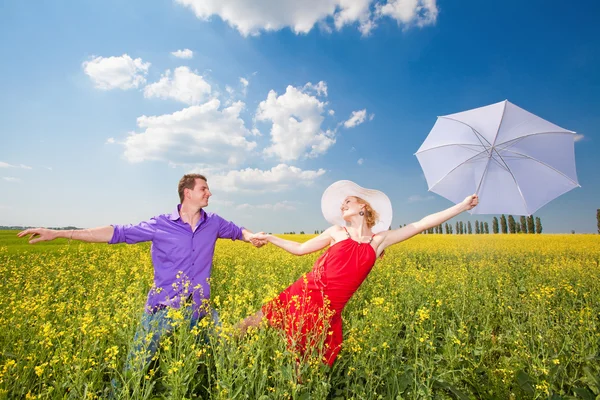 Young love Couple smiling under blue sky Stock Photo