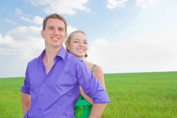 Young love Couple smiling under blue sky Royalty Free Stock Images