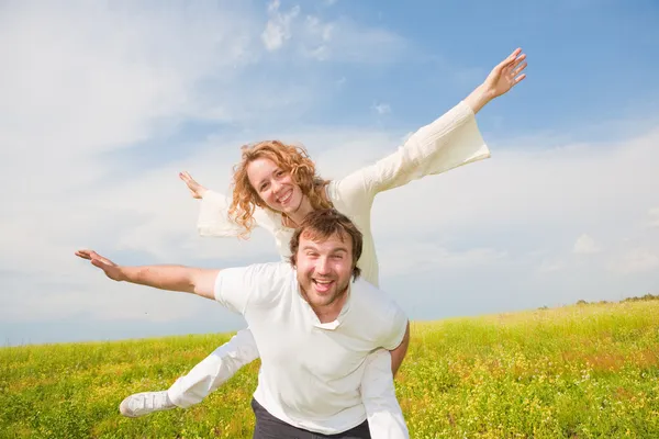 Young love Couple smiling under blue sky Stock Photo