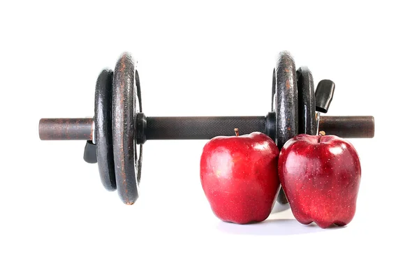 Hantlar och röda äpplen — Stockfoto