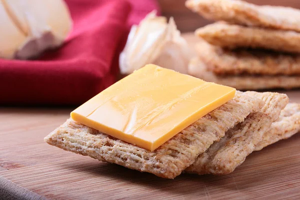 Wheat crackers with cheese — Stock Photo, Image