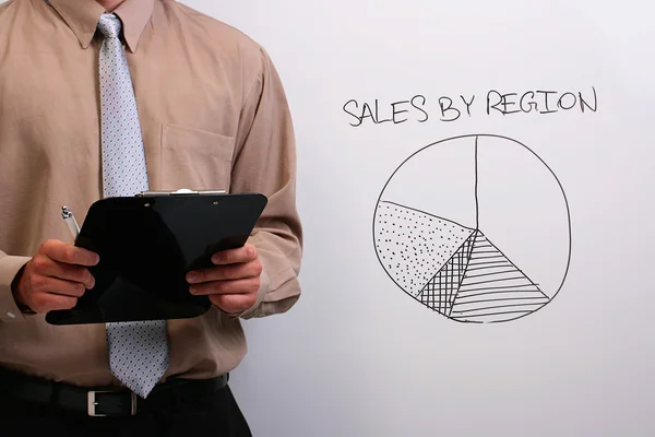 Man explaining a pie chart — Stock Photo, Image