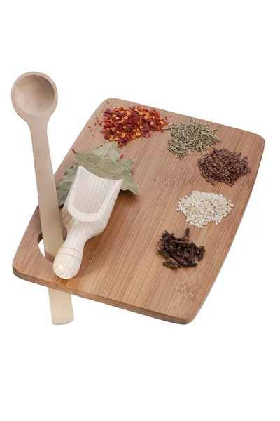 Kitchen board with spices — Stock Photo, Image