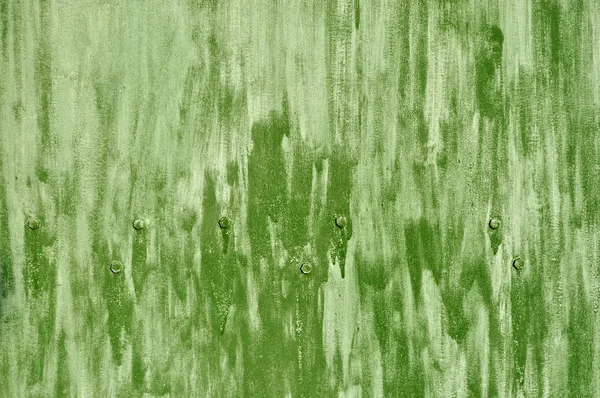 Superficie di colore verde grezzo con bulloni — Foto Stock