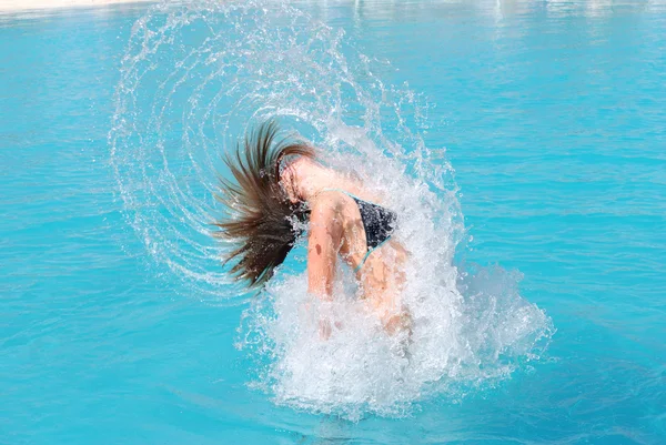 Jumping out of pool — Stock Photo, Image