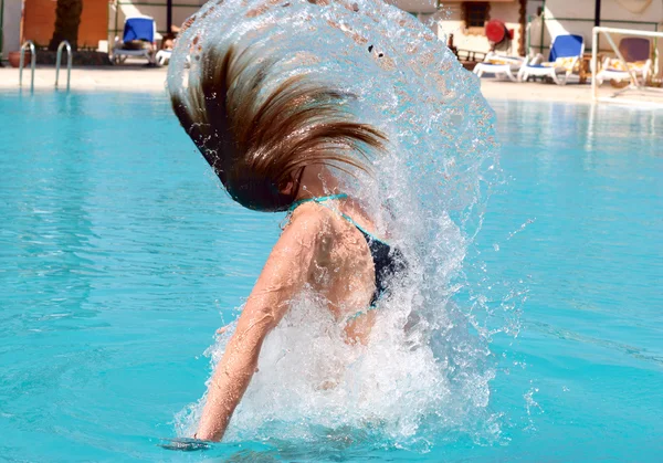 Jumping out of pool — Stock Photo, Image