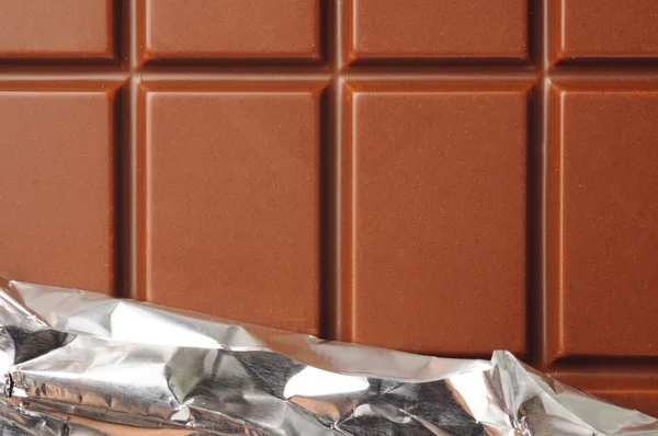 Closeup of chocolate with foil wrapping — Stock Photo, Image
