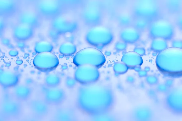 Blauwe waterdruppels — Stockfoto