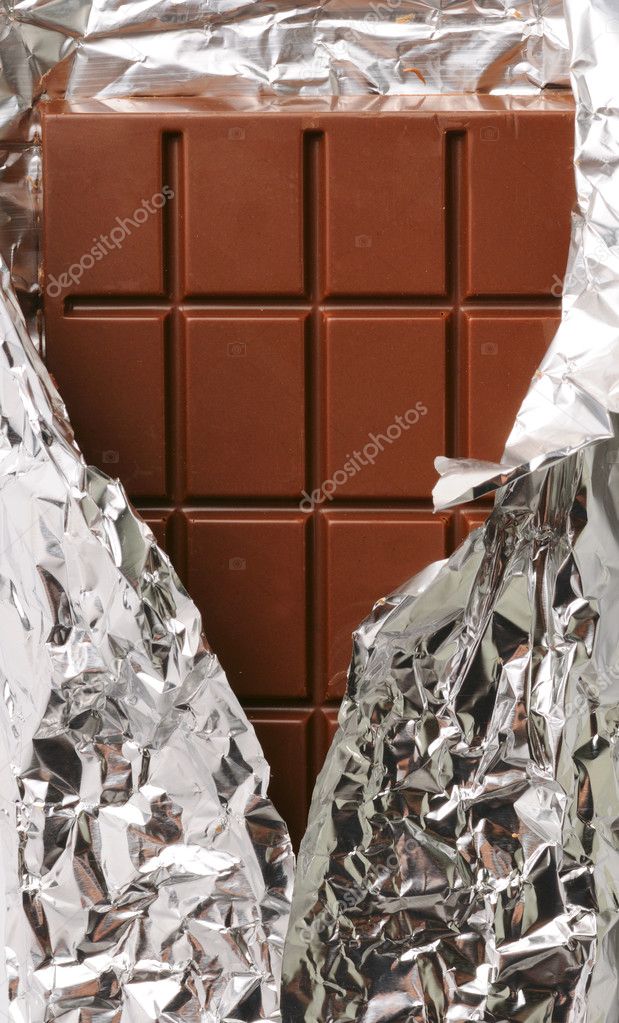 Closeup of chocolate with foil wrapping Stock Photo by ©sergeypeterman