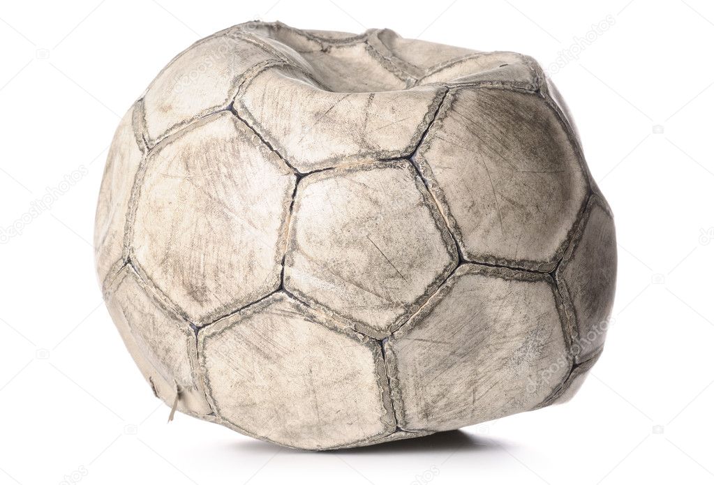 Old deflated soccer ball isolated on white