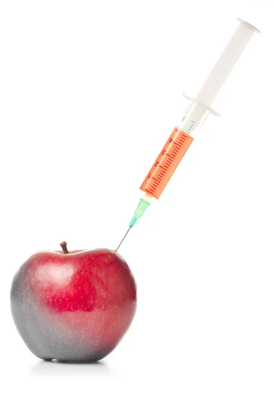Syringe in red apple isolated on white — Stock Photo, Image