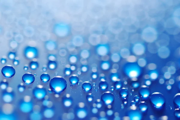 Flying gotas de agua azul —  Fotos de Stock
