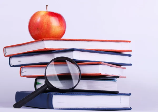 Ripe apple on stack of books — Stock Photo, Image
