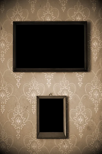 Zwei Fotorahmen an der Wand — Stockfoto