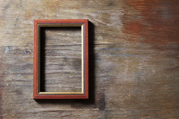 Empty frame on wooden background — Stock Photo, Image