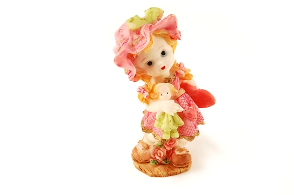Menina com uma boneca. Estatueta . — Fotografia de Stock