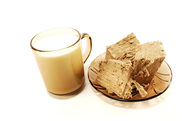 A cup of milk and halva — Stock Photo, Image