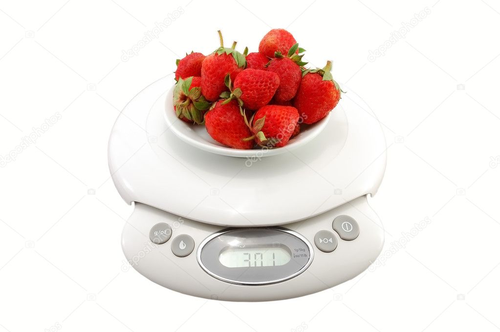 Strawberries in bowl on the scales