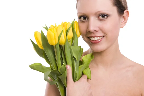 Mujer joven con tulipanes amarillos —  Fotos de Stock