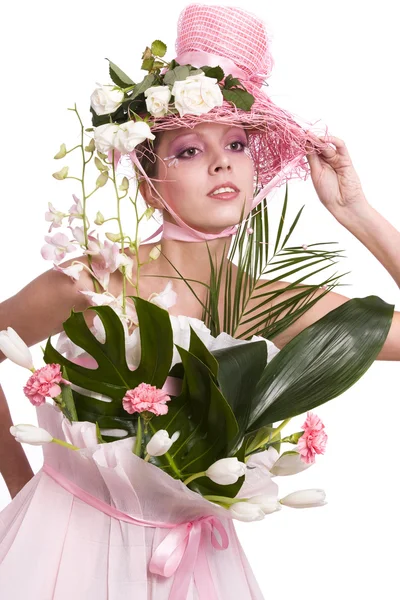 Femme de mode est un bouquet de fleurs . — Photo