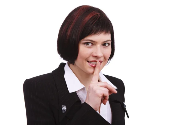 Geschäftsfrau mit dem Finger auf den Lippen — Stockfoto
