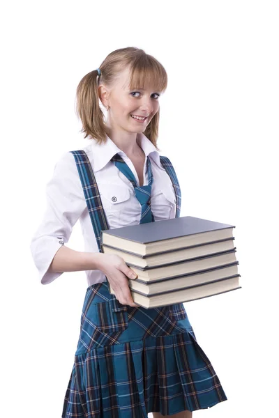 Школьница со стопкой книг . — стоковое фото