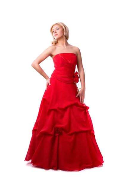 赤いドレスの美しい若い女性 ストック画像