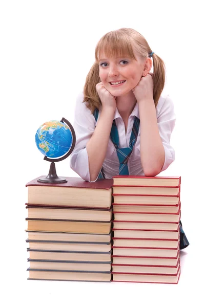 Estudante com a pilha de livro e globo — Fotografia de Stock