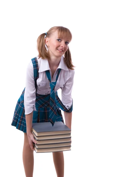 Kız öğrenci kitap yığınını düzenliyor. — Stok fotoğraf