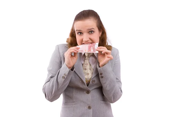 Mujer de negocios comiendo algo de dinero —  Fotos de Stock