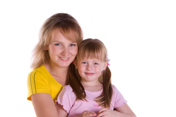 Happy family - mother and daughter are embracing. Stock Photo