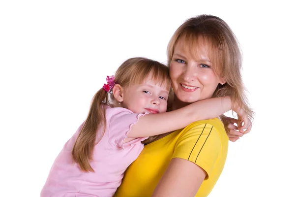 Happy family - mother and daughter are embracing. Royalty Free Stock Images