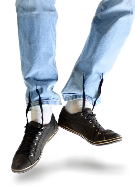 stock image Legs in jeans and dirty sneakers