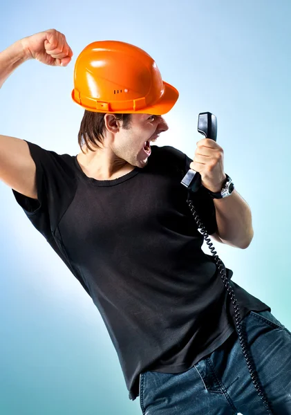 Workman screaming on phone — Stock Photo, Image