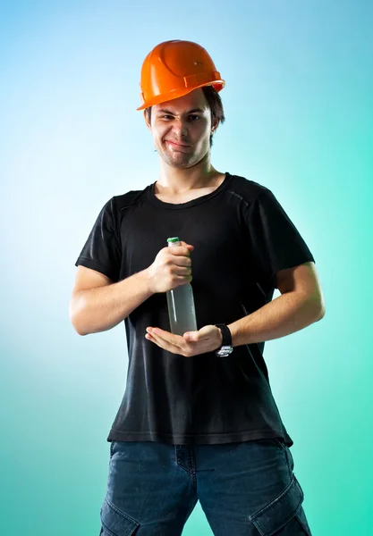 Workman with bottle — Stock Photo, Image