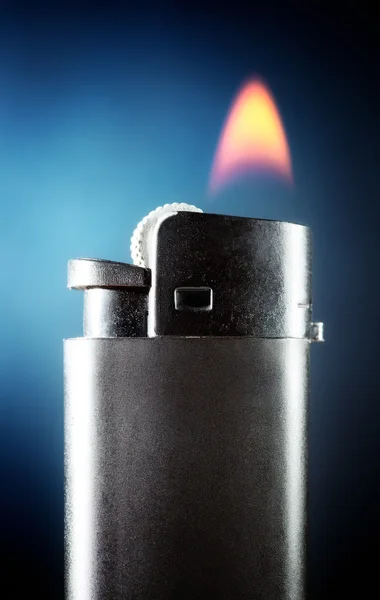 Lighter with burning flame — Stock Photo, Image