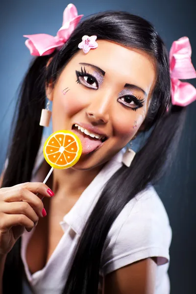 Young woman with lollipop — Stock Photo, Image