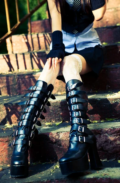Young goth woman sitting on stairs — Stock Photo, Image
