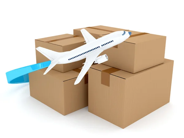 Paquetes de cartón con avión sobre blanco — Foto de Stock