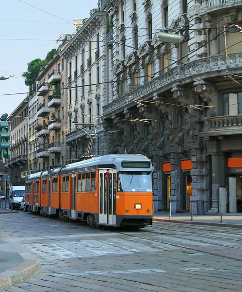 Milan street with orange tram — Stock Photo, Image