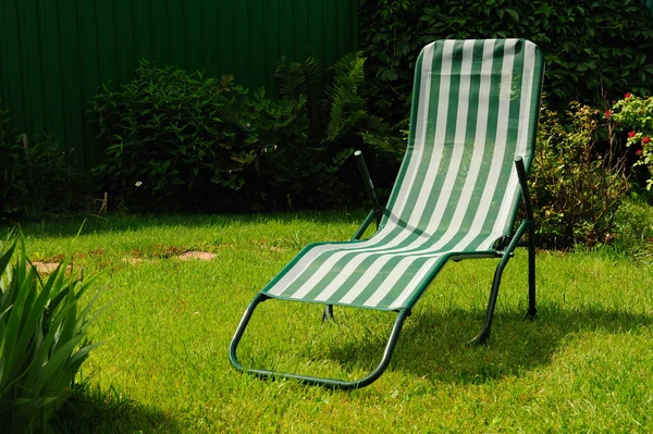 stock image Chaise lounge on a grass