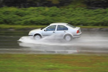 Driving in rainstorm clipart