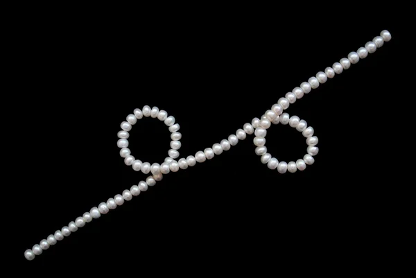 White pearls on the black velvet — Stock Photo, Image