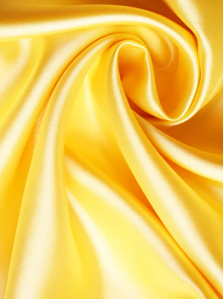 Гладкий элегантный золотой атлас — стоковое фото